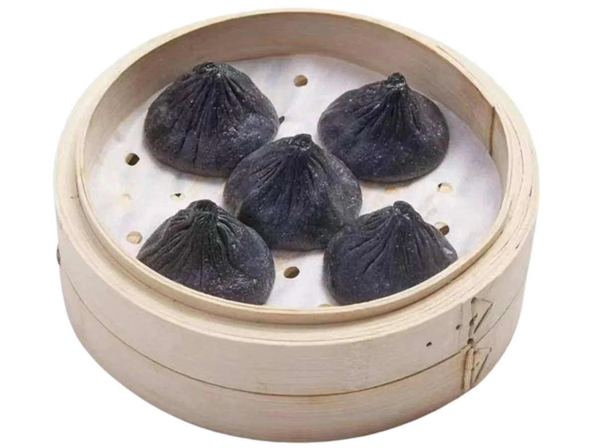 Black squid ink soup dumplings in bamboo steamer at Hui Jiang Nan Dumpling Eatery, a Dumpling Restaurant in Minneapolis